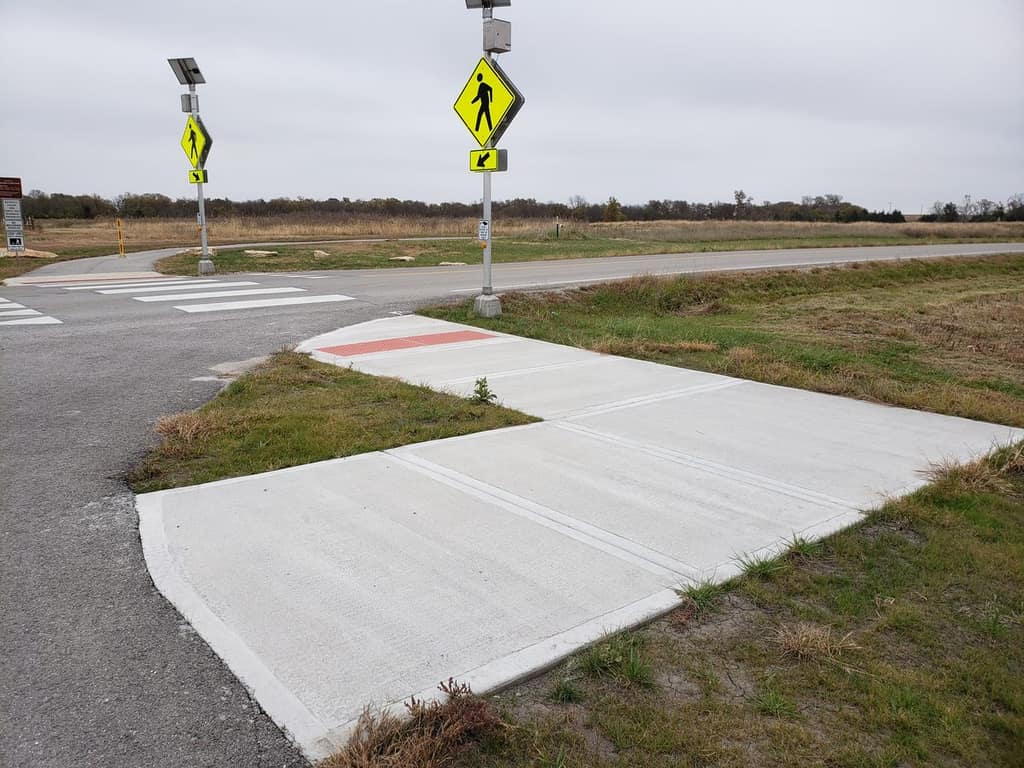 A new sidewalk and ADA accessible crosswalk between Martin Creek Park and Big Bull Creek Park