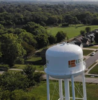 A drone shot of west Edgerton with the water tower in the foreground